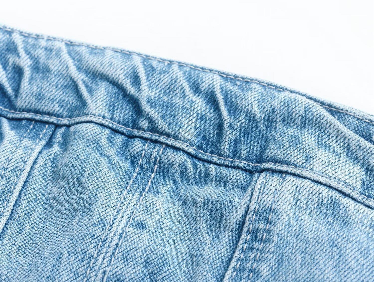 A stretch Marina mini dress, designed for comfort and style with its form-fitting silhouette and short length.