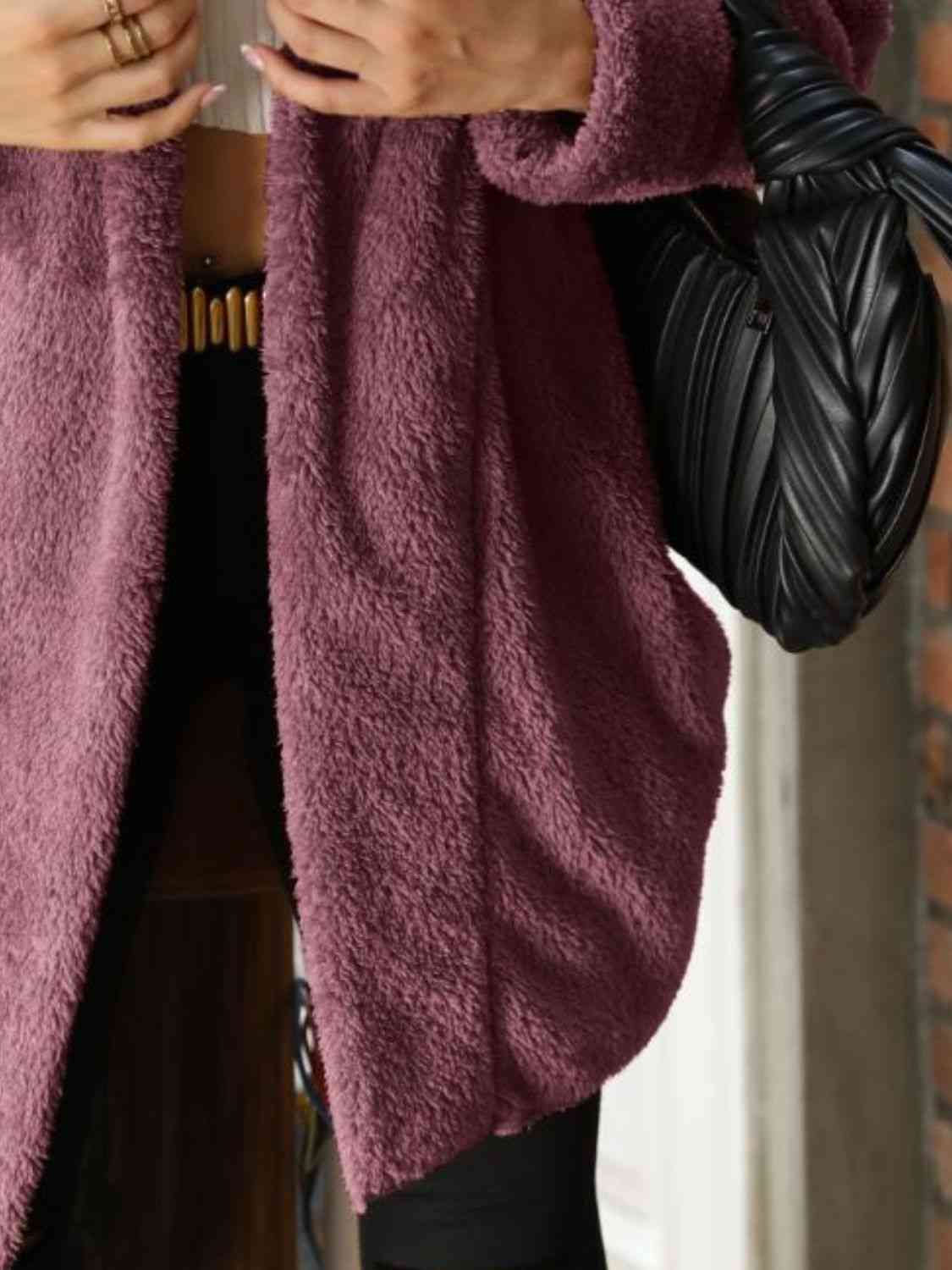 A hooded coat, providing added protection and style with its attached hood for shielding against the elements.