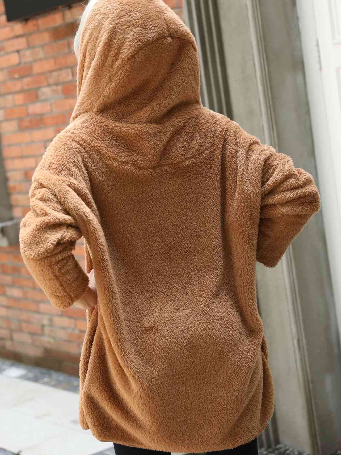 A hooded coat, providing added protection and style with its attached hood for shielding against the elements.