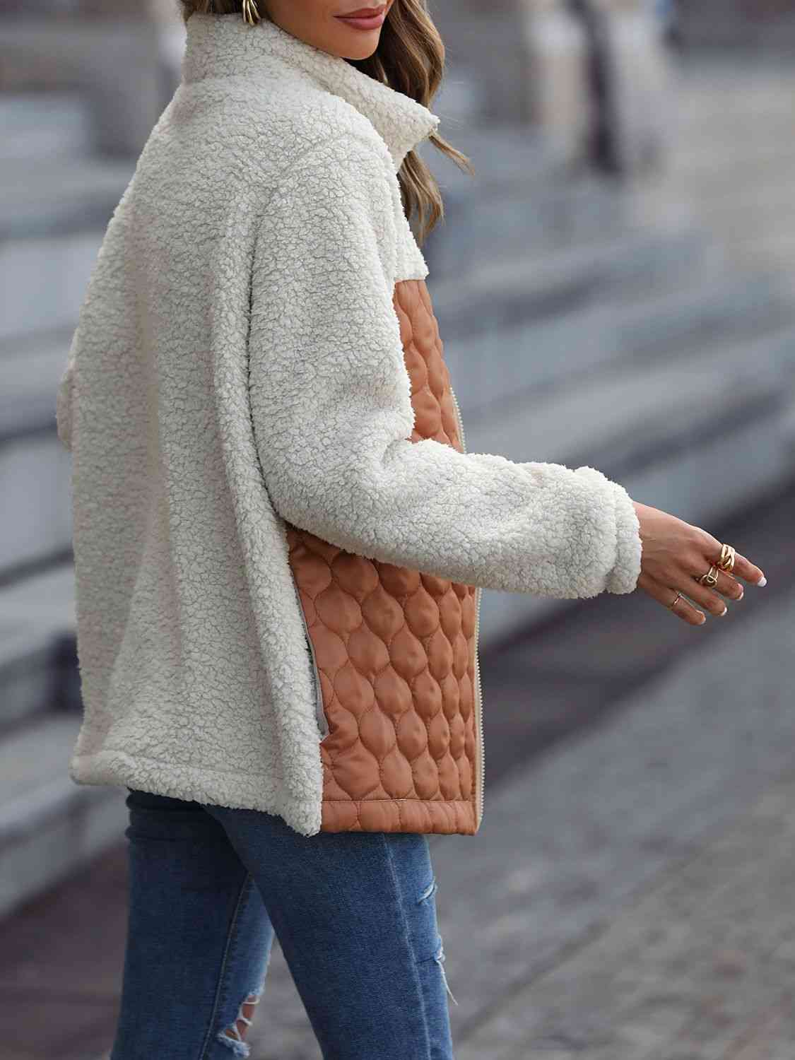 A zip-up jacket with convenient pockets, combining style and practicality for everyday wear.