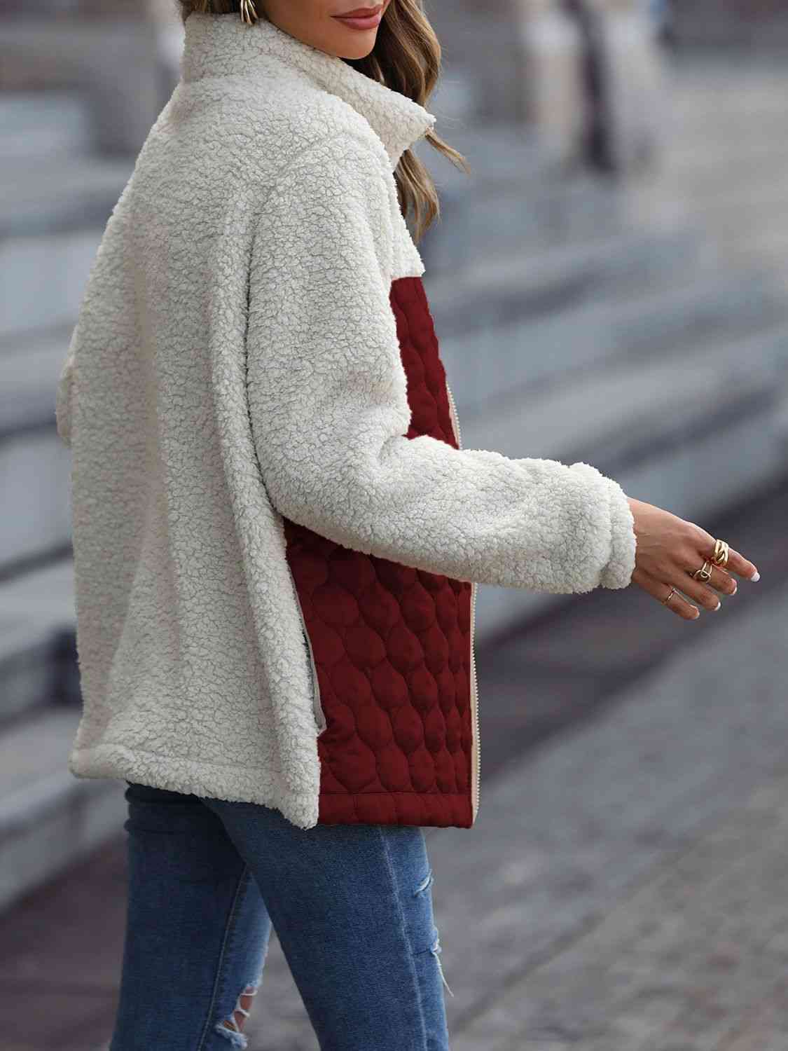 A zip-up jacket with convenient pockets, combining style and practicality for everyday wear.