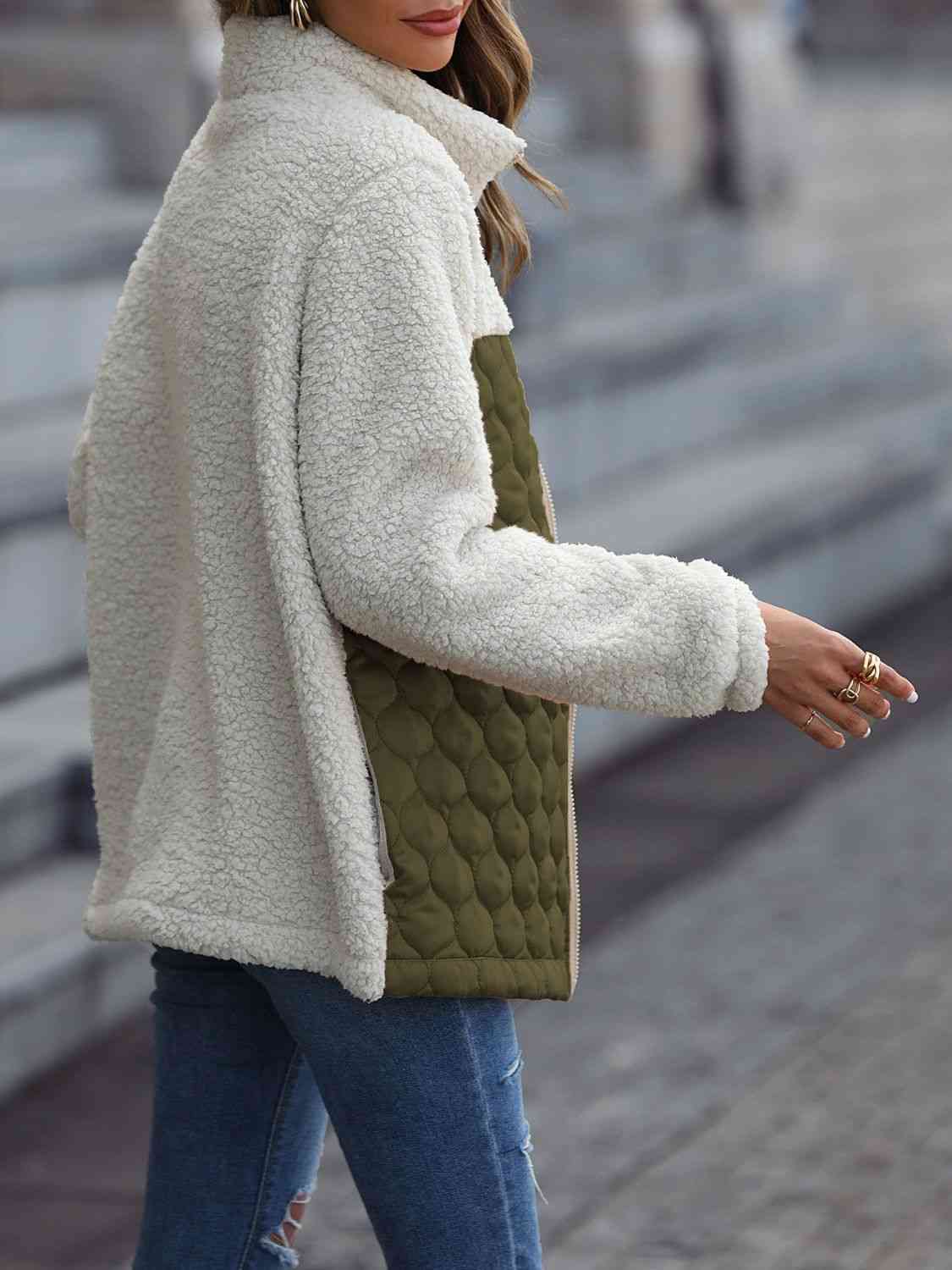 A zip-up jacket with convenient pockets, combining style and practicality for everyday wear.