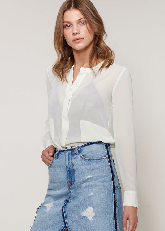 Elevate your style with our collection of classic button-up blouses. Shop now for timeless elegance that complements any look.