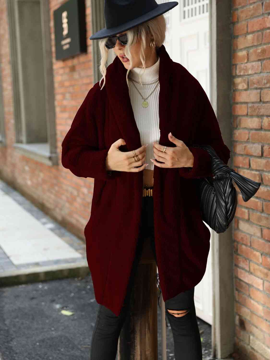 A hooded coat, providing added protection and style with its attached hood for shielding against the elements.