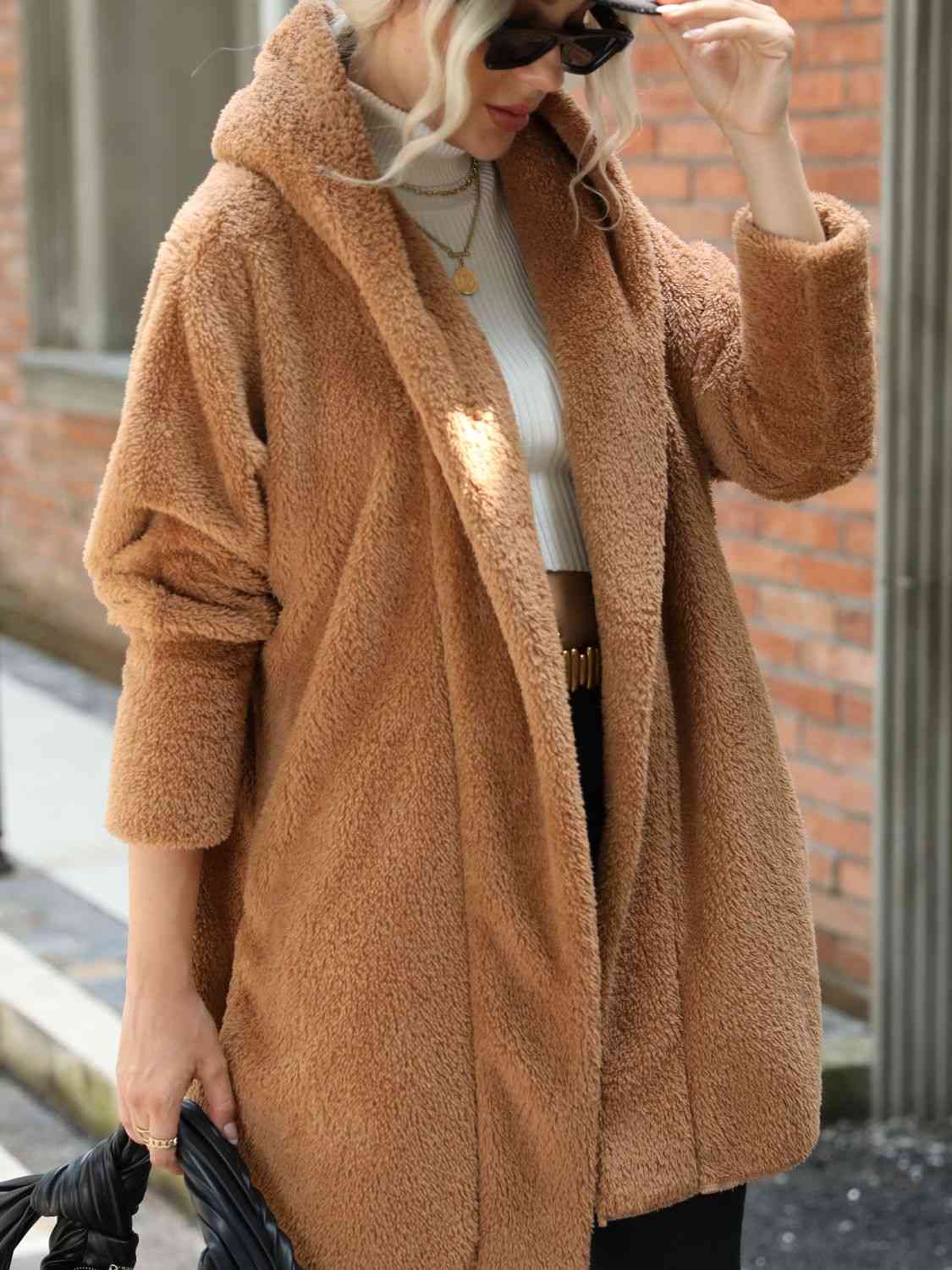 A hooded coat, providing added protection and style with its attached hood for shielding against the elements.