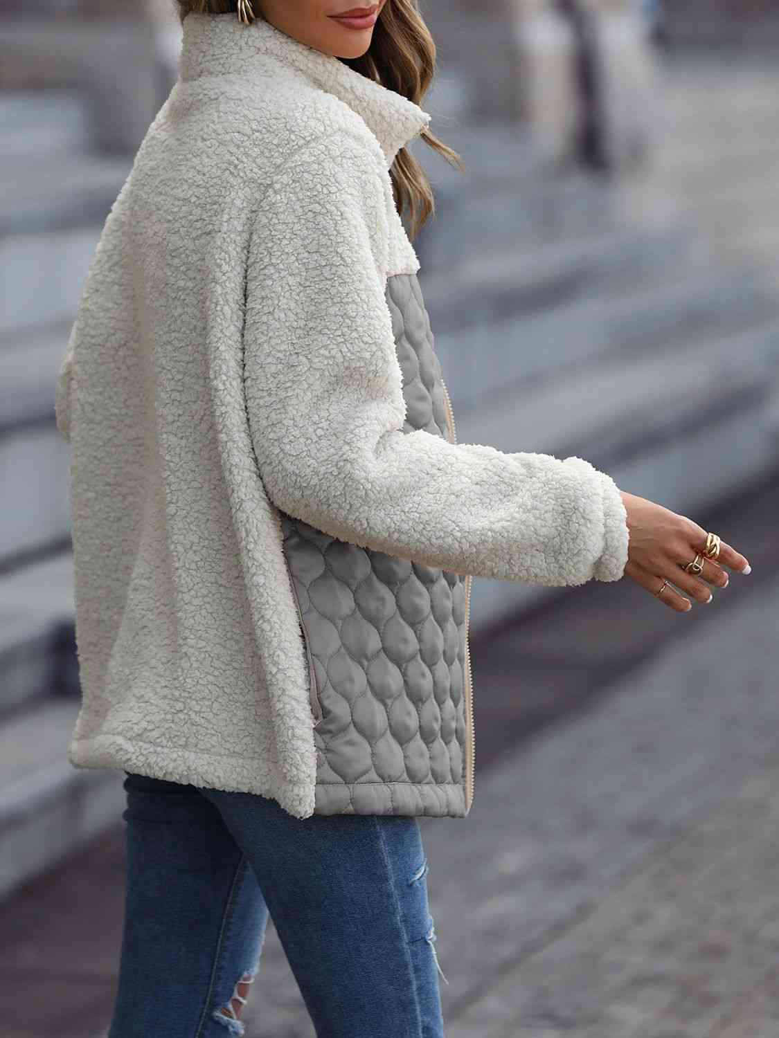 A zip-up jacket with convenient pockets, combining style and practicality for everyday wear.