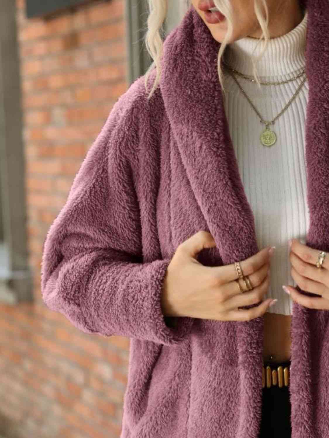 A hooded coat, providing added protection and style with its attached hood for shielding against the elements.