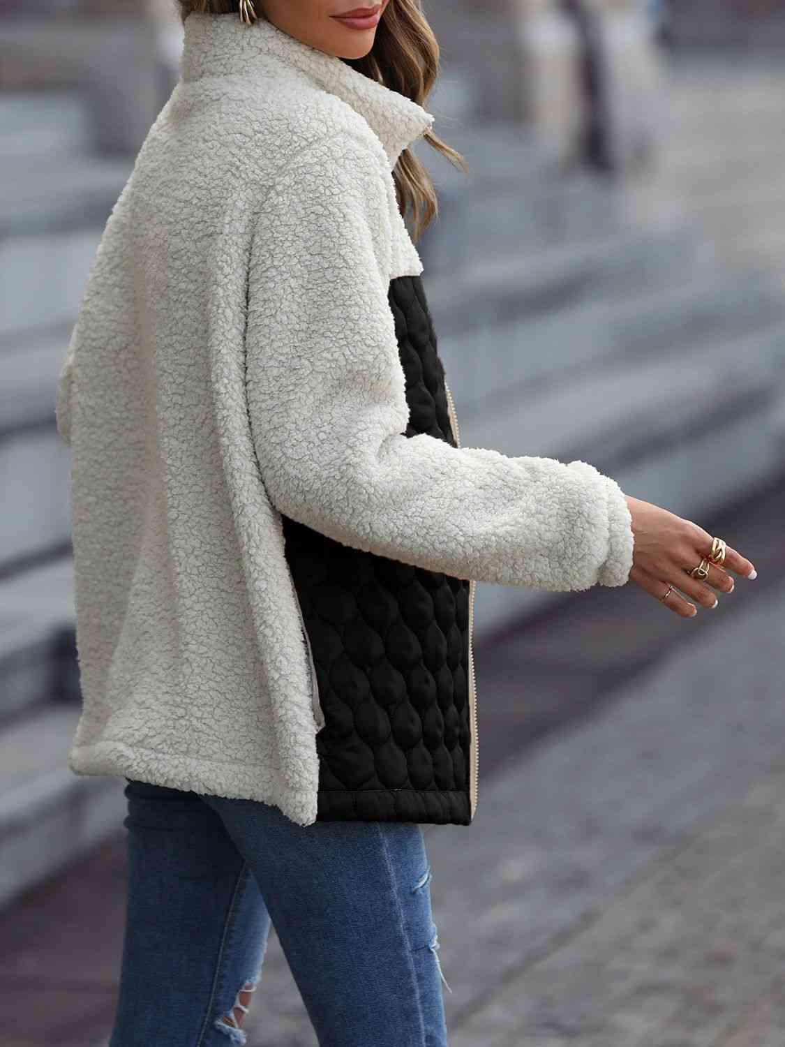 A zip-up jacket with convenient pockets, combining style and practicality for everyday wear.