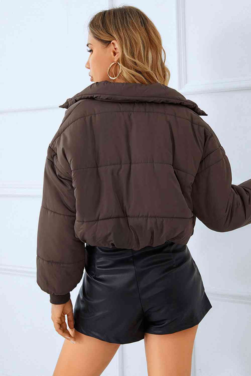 a warm and stylish winter coat in a rich, deep shade of navy blue. The coat features a faux fur-lined hood, zippered front, and ample pockets for added convenience. Perfect for staying cozy and fashionable during the cold winter months.A winter coat designed for warmth and functionality, featuring multiple spacious pockets for added convenience.