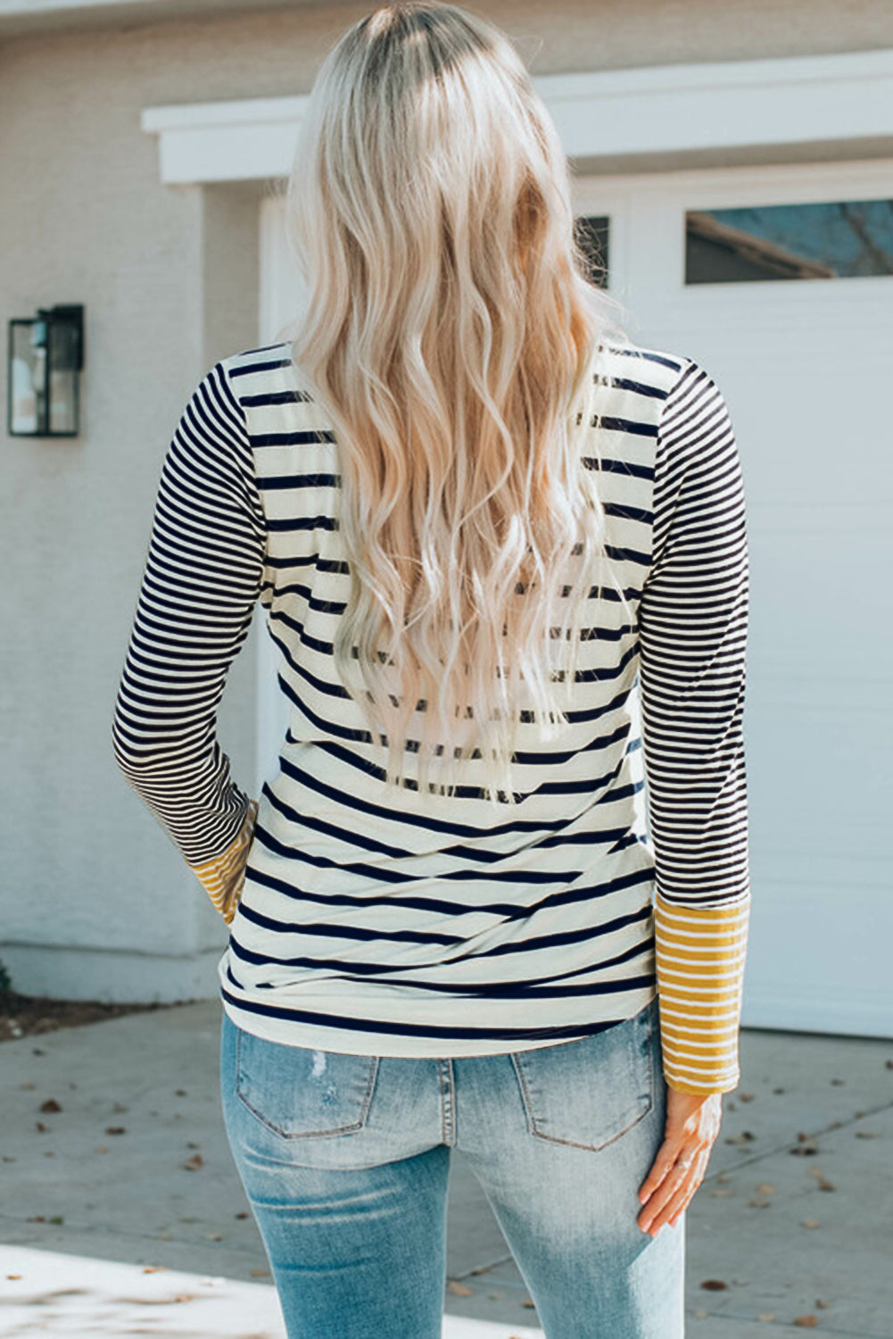 Striped Buttoned Top' featuring a top with stripes and button accents, offering a classic and stylish addition to your wardrobe.