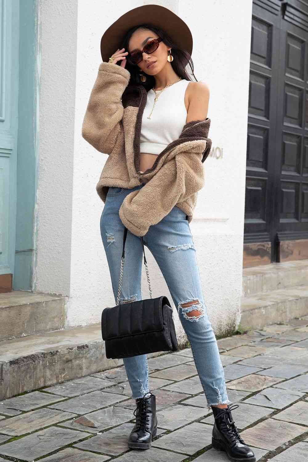 A 'Neck Fuzzy Jacket,' a cozy and warm jacket typically featuring a soft and fuzzy material around the neck or collar area, providing comfort and style for chilly weather.