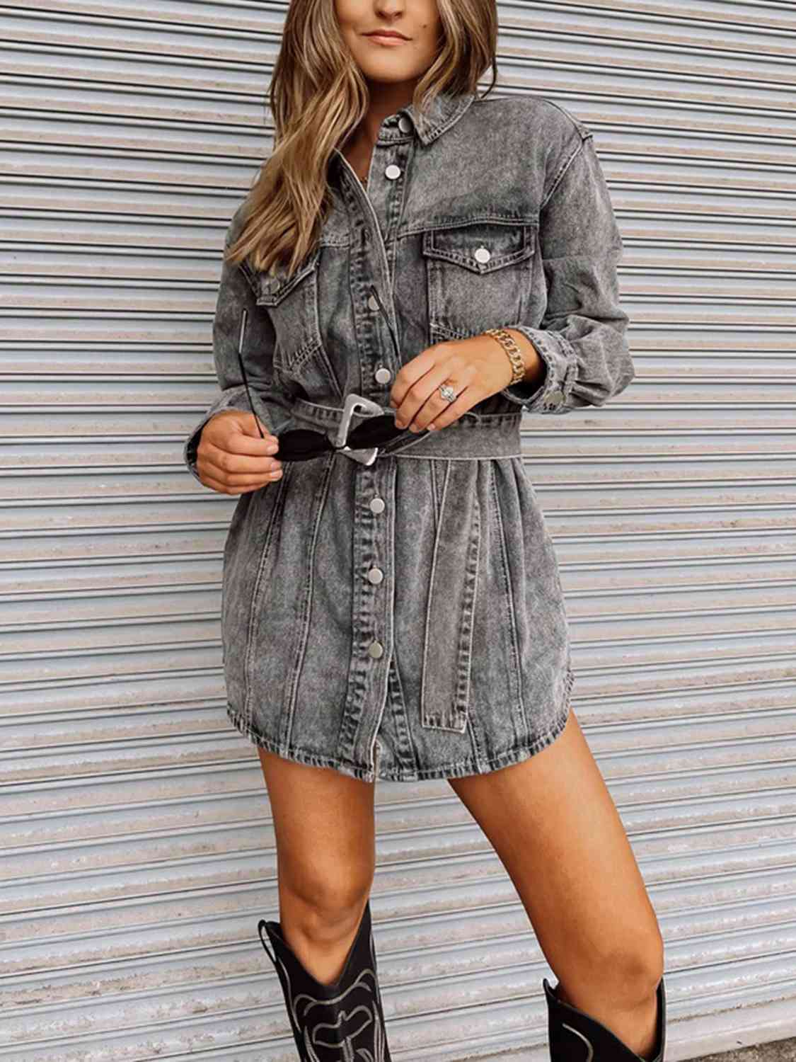 A buttoned denim dress, offering a fashionable and comfortable outfit with its classic denim fabric and front-button closure.