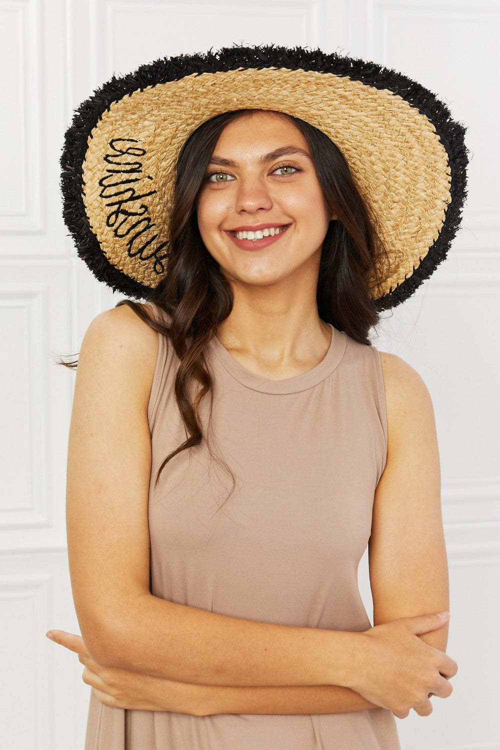 Straw Fringe Hat: A charming and bohemian-style hat made from straw and adorned with fringe details, perfect for adding a touch of flair to your outfit.