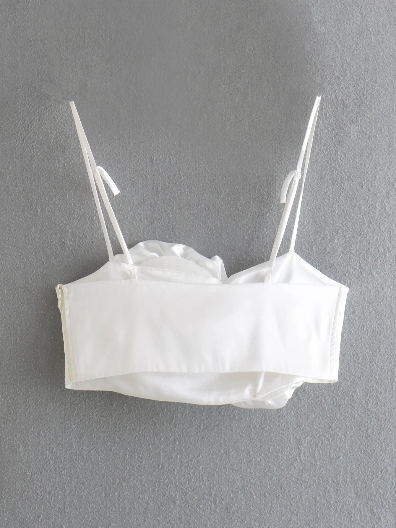 White Spaghetti Strap Tops: Sleek and summery tops featuring delicate spaghetti straps in a crisp white color, perfect for warm-weather styling.