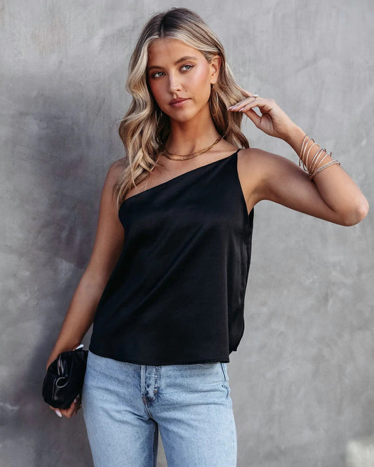 A solid color off-shoulder top, featuring a single hue and an off-shoulder neckline for a chic and trendy appearance.
