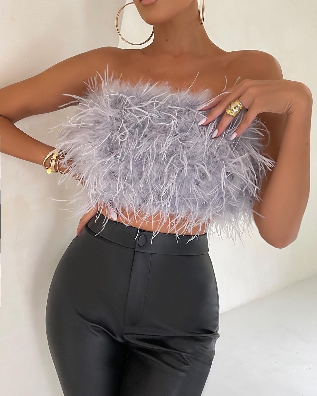 Furry Strapless Top: A stylish and textured top featuring a soft and furry fabric and a strapless neckline for a chic and trendy look.