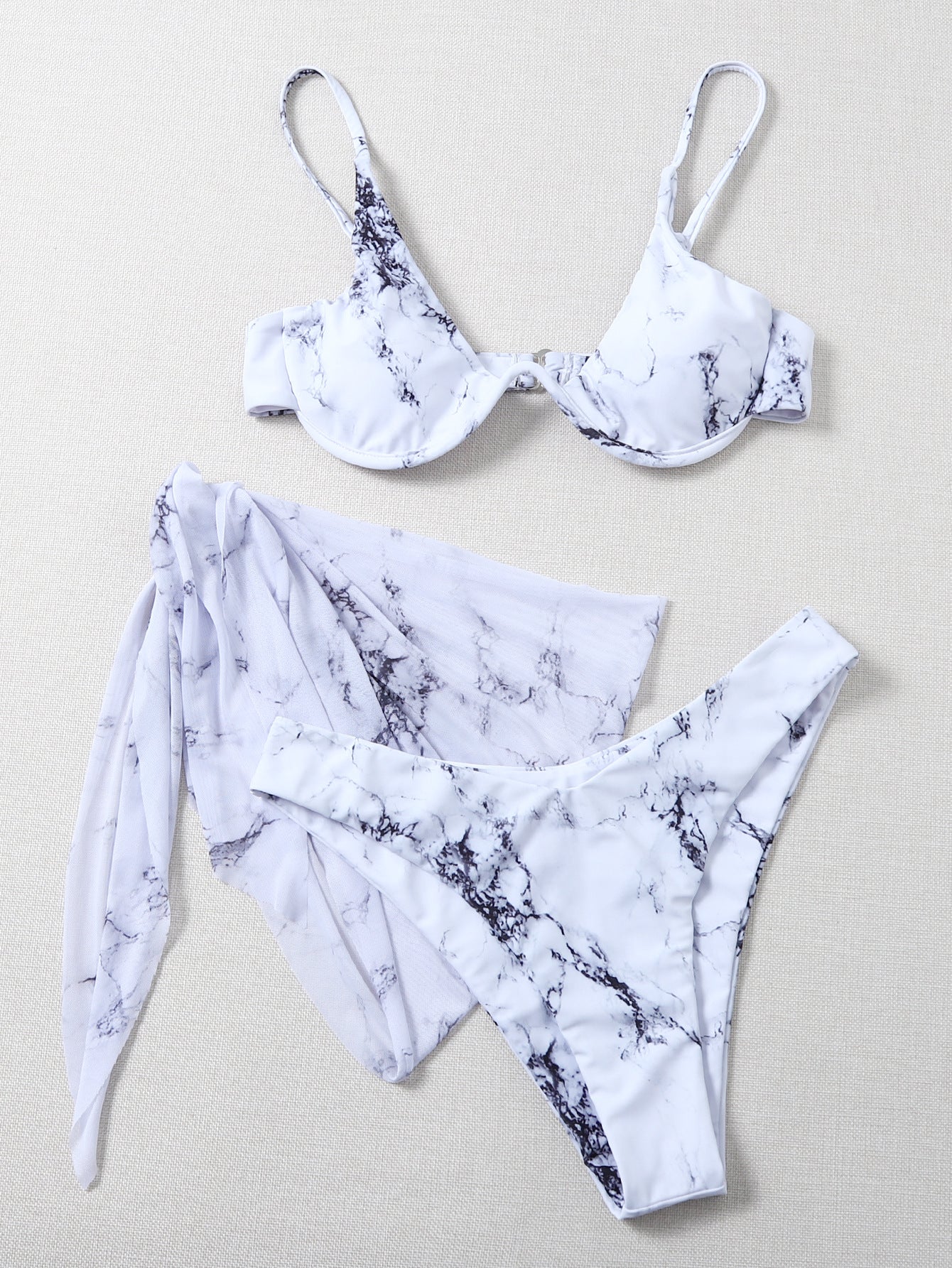 Marble Print Swimsuit: A swimwear piece featuring a stylish marble pattern, adding a unique and fashionable touch to your beach or poolside look.