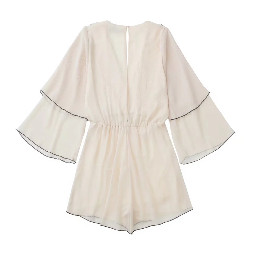 Ruffles Tiered Romper' showcasing a romper with tiered layers and charming ruffle details for a playful and stylish appearance.