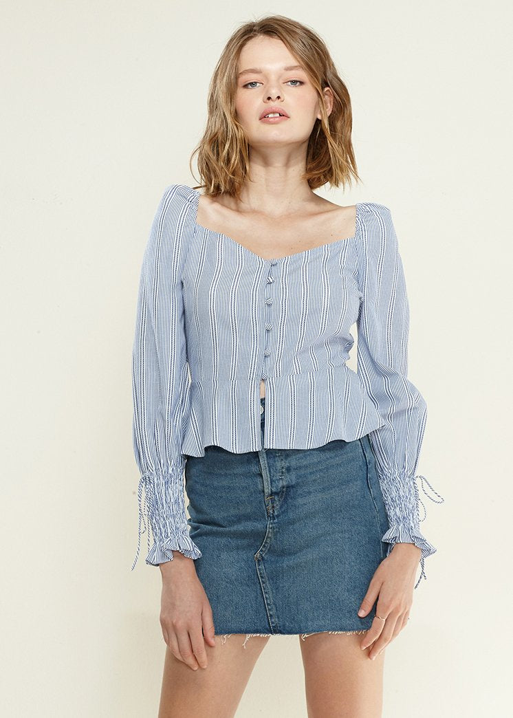 Blue Off-Shoulder Blouse' featuring a blouse in a vibrant blue color with an off-shoulder neckline, creating a chic and stylish look.