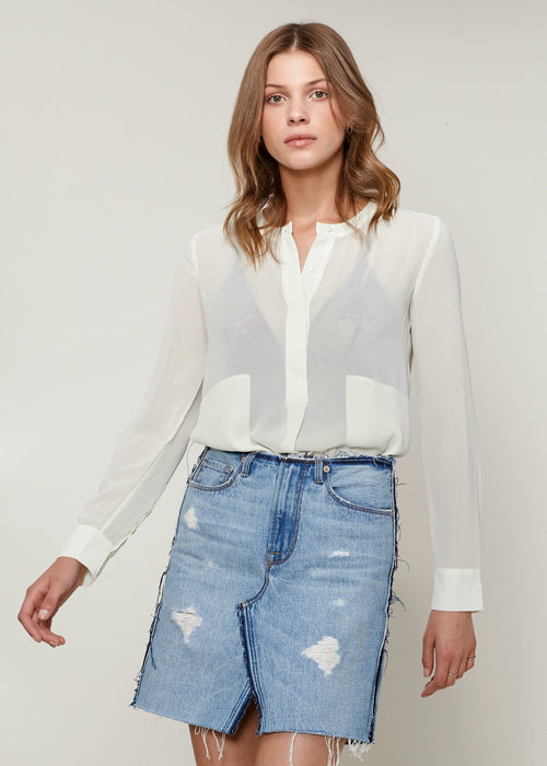 Elevate your style with our collection of classic button-up blouses. Shop now for timeless elegance that complements any look.