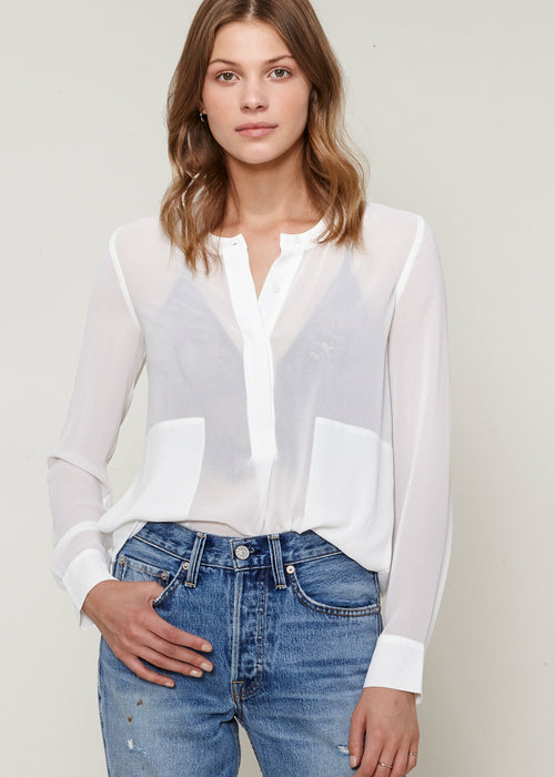 Elevate your style with our collection of classic button-up blouses. Shop now for timeless elegance that complements any look.