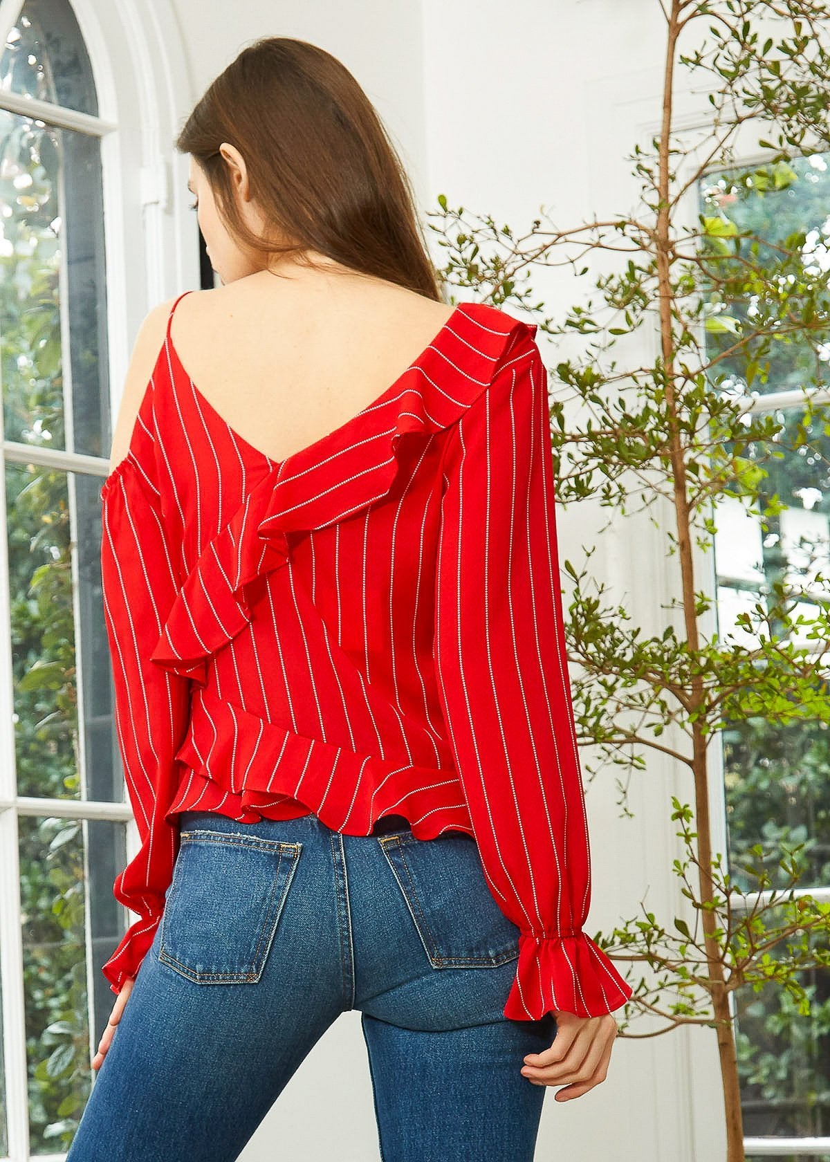 Make a statement with our stunning red ruffle blouse. Perfect for any occasion, this blouse exudes elegance and confidence. Shop now!