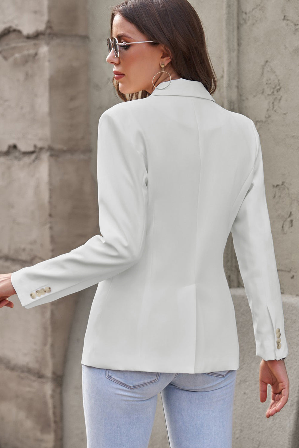 Flap pocket blazer, emphasizing its structured silhouette and functional flap pockets, merging fashion with utility.