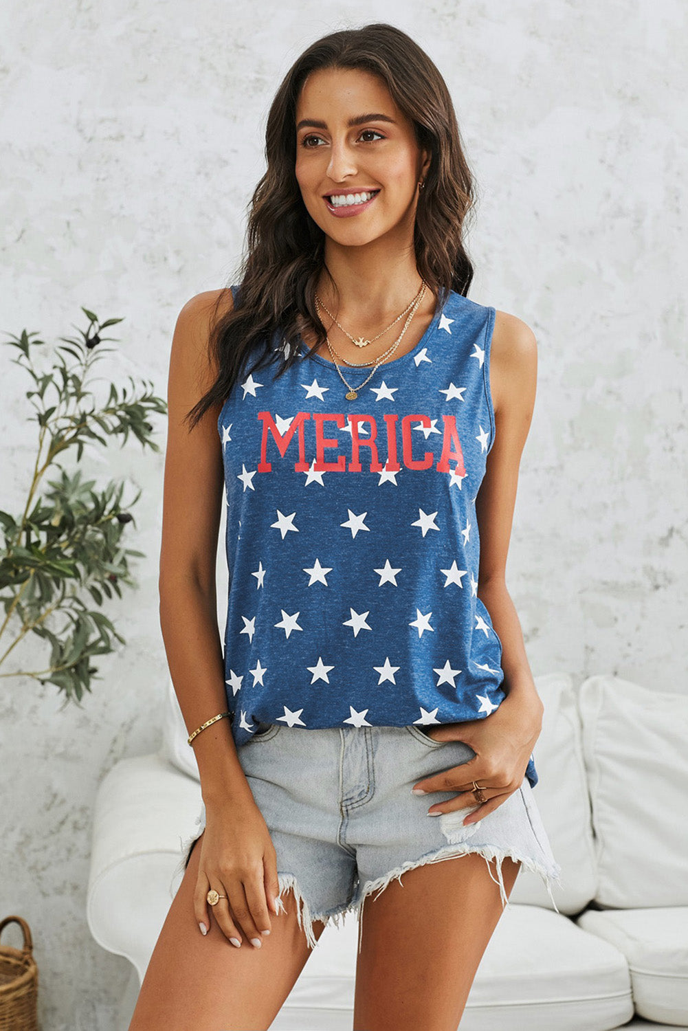 Star Print Tank' describing a tank top adorned with a star pattern, offering a stylish and eye-catching addition to your wardrobe.