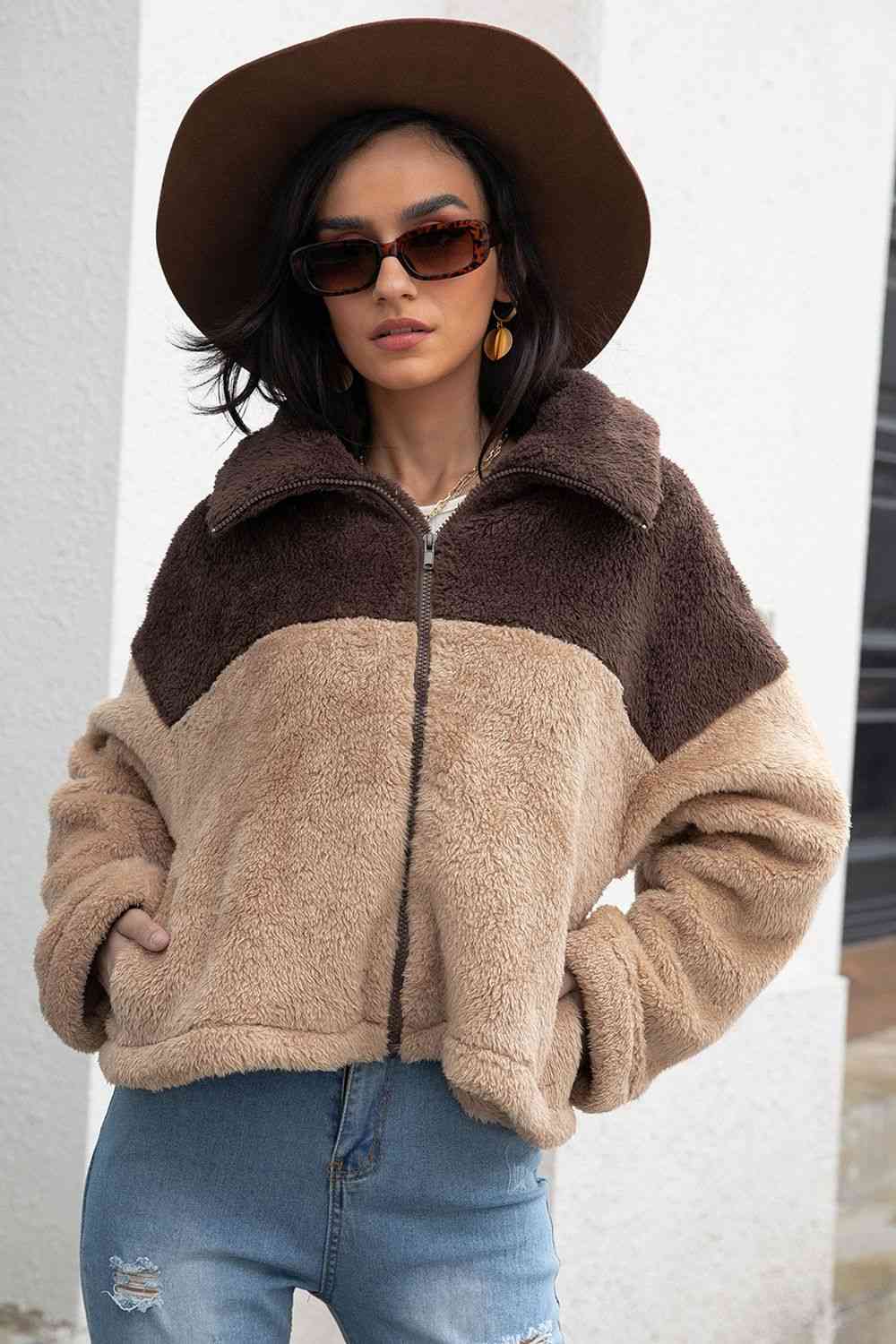 A 'Neck Fuzzy Jacket,' a cozy and warm jacket typically featuring a soft and fuzzy material around the neck or collar area, providing comfort and style for chilly weather.