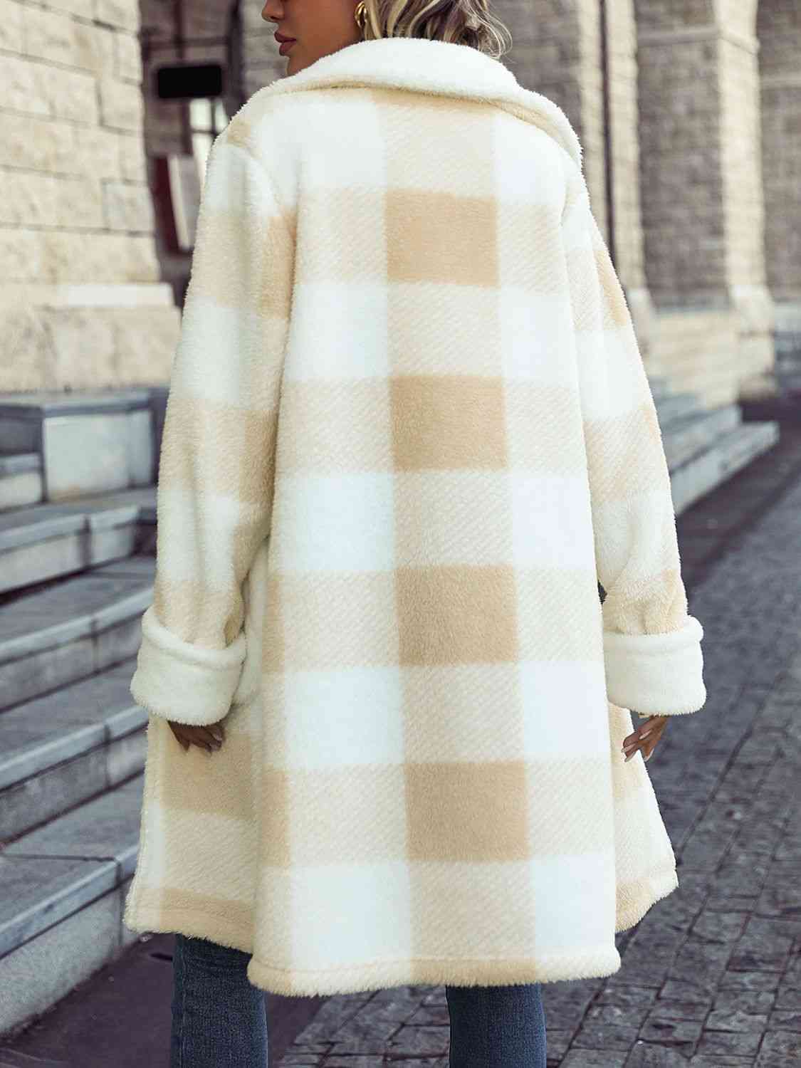 A plaid button coat, showcasing a timeless and fashionable pattern, secured with buttons for a stylish and warm winter look.