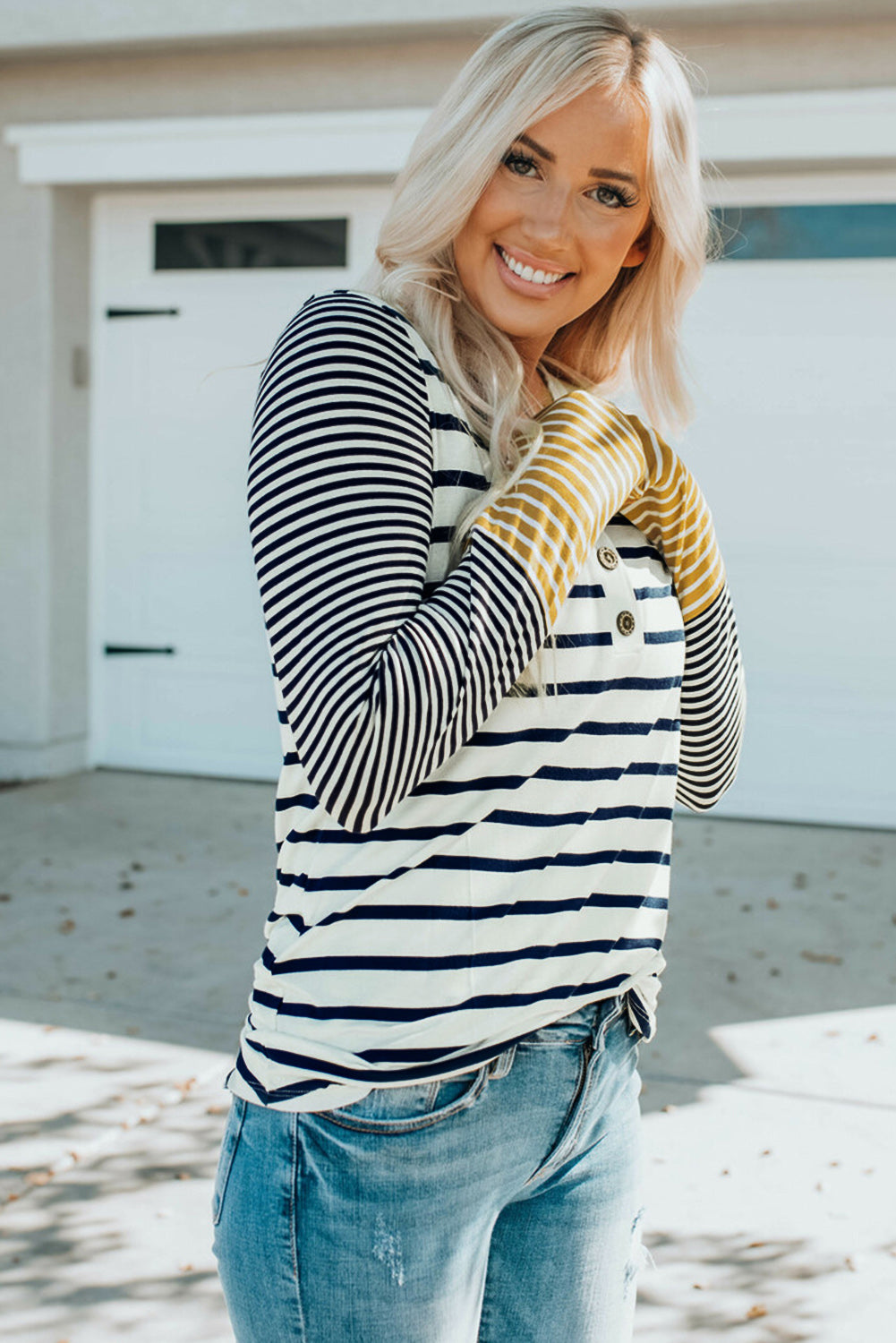 Striped Buttoned Top' featuring a top with stripes and button accents, offering a classic and stylish addition to your wardrobe.