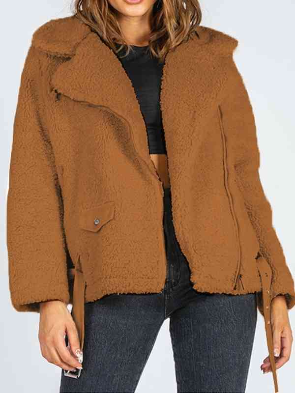 A 'Belted Sherpa Jacket,' a cozy and warm outerwear piece typically made from sherpa or faux sherpa material, featuring a belt for a stylish and snug fit, perfect for cold weather.