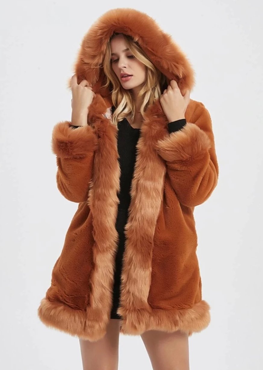 Stay glamorous and warm with our faux fur coat, a stylish choice for colder days.